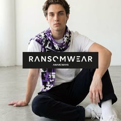 Awareways campaign image for Ransomwear. Featuring a man presenting the unique awareness scarf, a symbol of cyber resilience and digital security. This represents an effective approach to addressing ransomware risks among businesses.